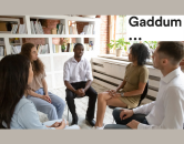 Gaddum logo and a group of 5 people sat in a circle talking